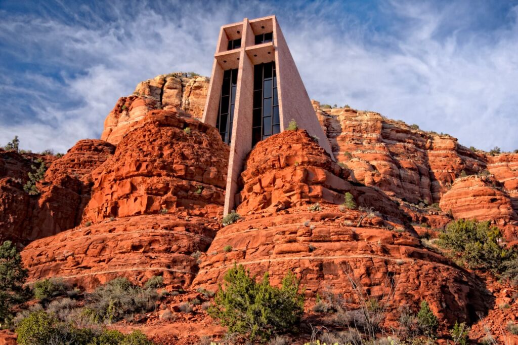 Nestled among the red rock buttes of Sedona, Arizona stands the Chapel of the Holy Cross