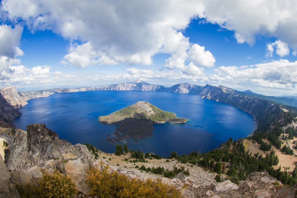 Photo showing Crater Lake form the top of Watchman's Peak, one of 8 US lakes great for boating