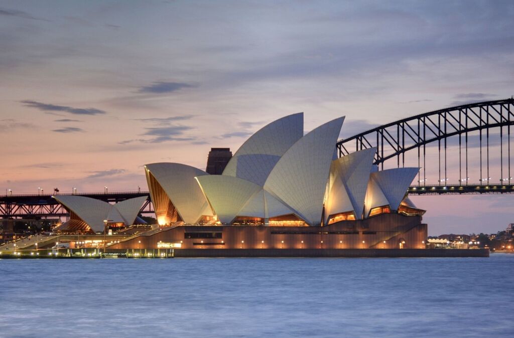 Photo showing Sydney Opera House with the Harbour Bridge in the Background in Australia -another of the UNESCO World Heritage Sites worth a visit