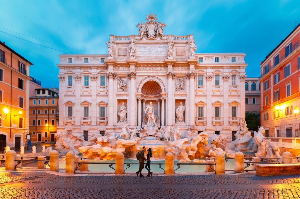 Couple Kissing at Dusk at the Trevi Fountain in Rome, Italy