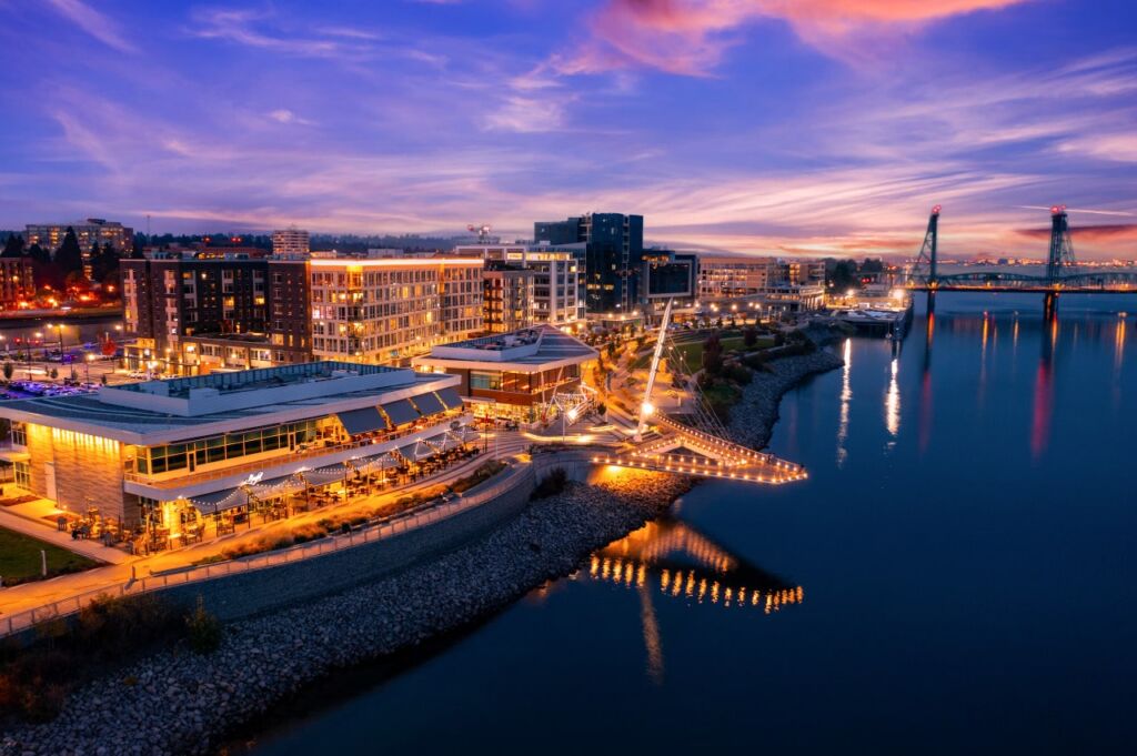 Walking path along the bay in Vancouver, British Columbia, Canada illuminated at night.