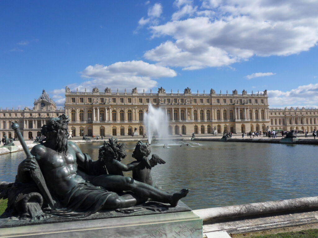 Versailles Palace with fountain in foreground, the most enchanting of the romantic palaces in this post.